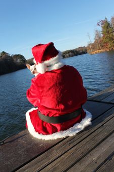 Santa On The Dock With His Dog Stock Image Santa On The Dock With His Dog Stock Image