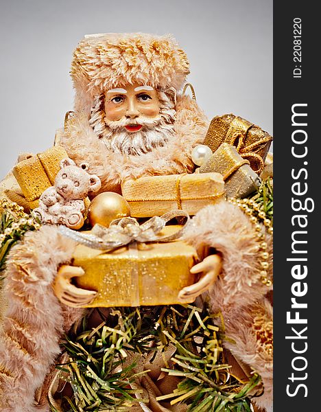 Santa Claus with golden Christmas gifts. Santa Claus with golden Christmas gifts