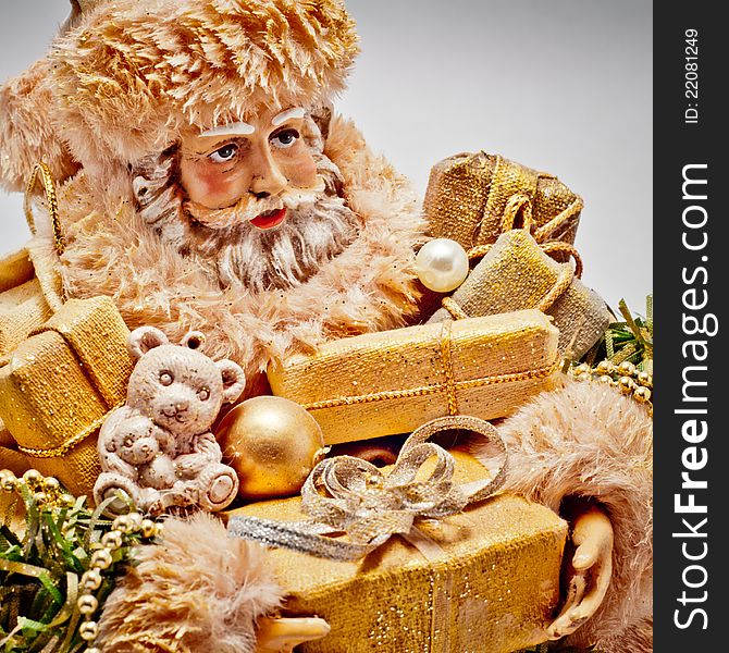 Santa Claus with golden Christmas gifts. Santa Claus with golden Christmas gifts