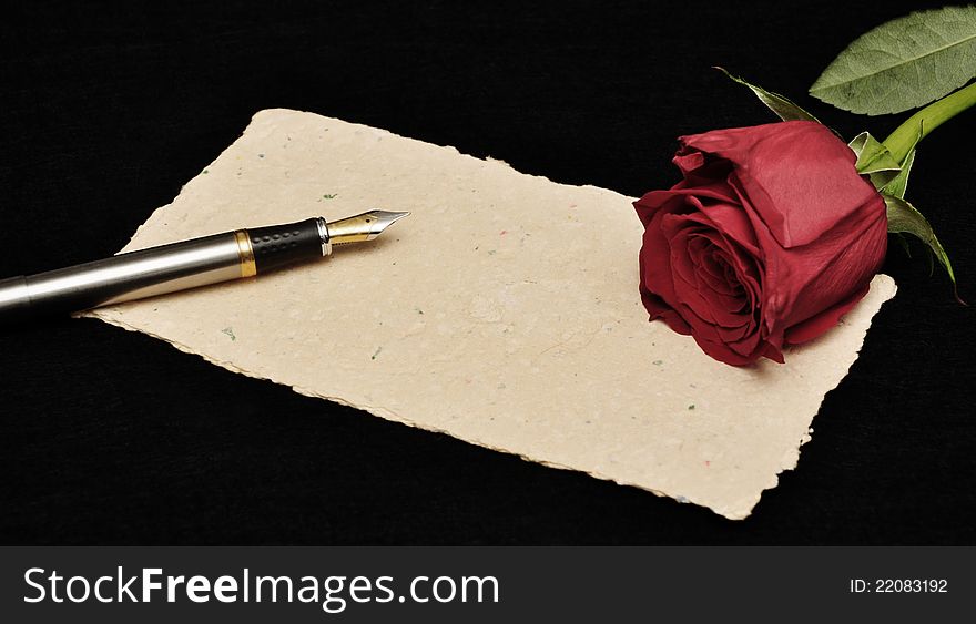 Fountain pen and red rose with writing space. Fountain pen and red rose with writing space