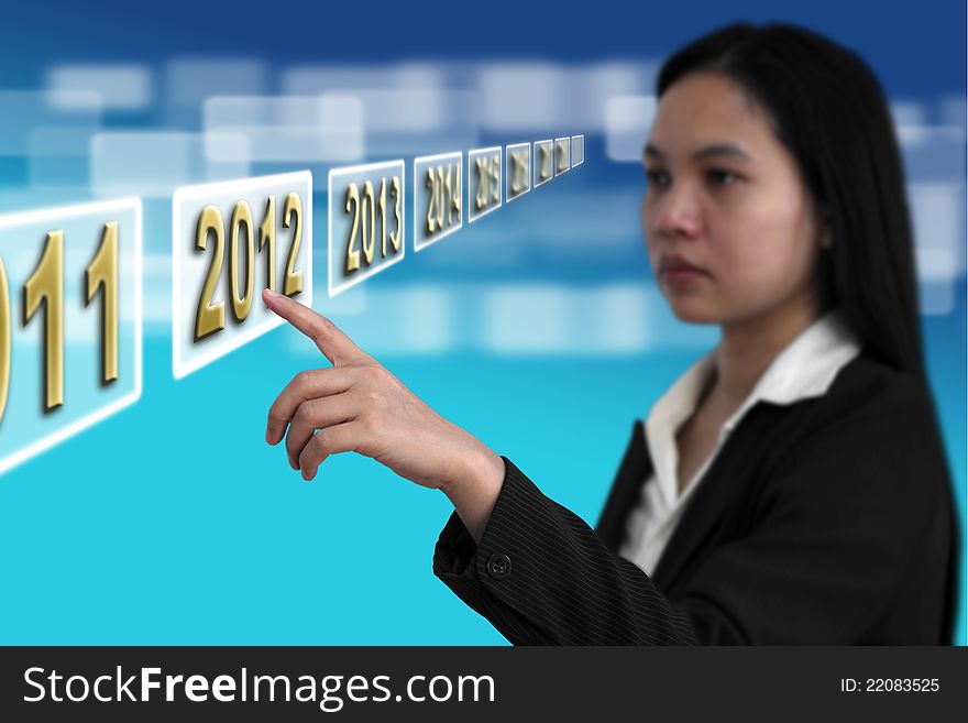 Business woman point to Year 2012 on touch screen interface