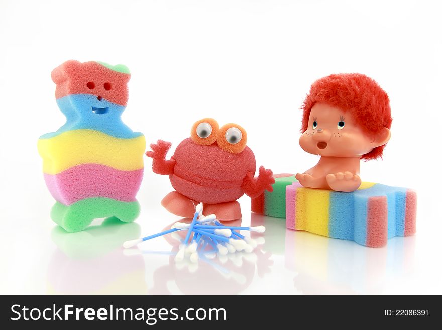 Full Color sponge for children in the form of bears and a brush frog made of natural materials on white background. Full Color sponge for children in the form of bears and a brush frog made of natural materials on white background.