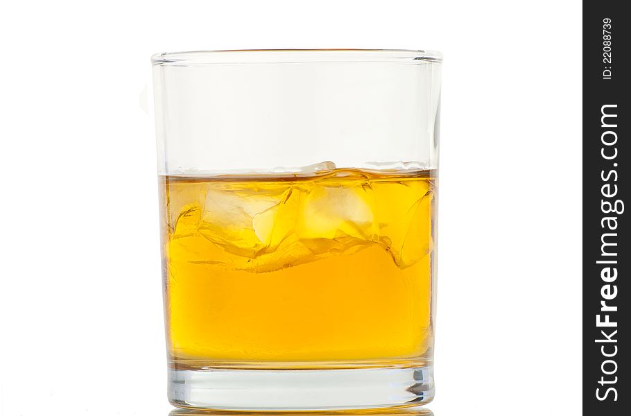 Whiskey with ice cubes. Isolated on white background