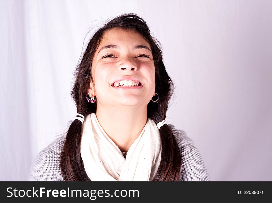 A tween girl laughing at herself. A tween girl laughing at herself.