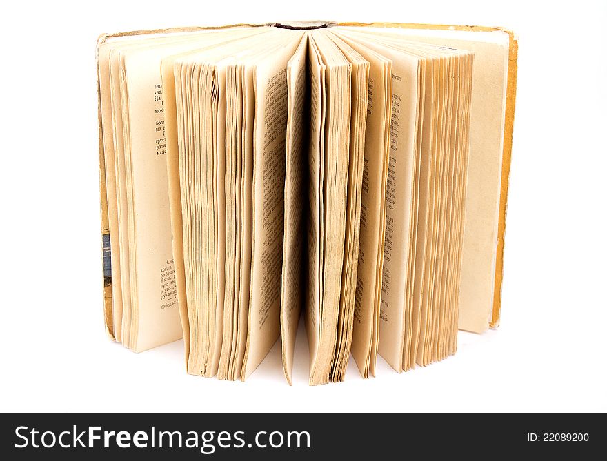 Open old book on white background isolated
