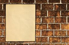 Old Paper On Brick Wall Royalty Free Stock Images