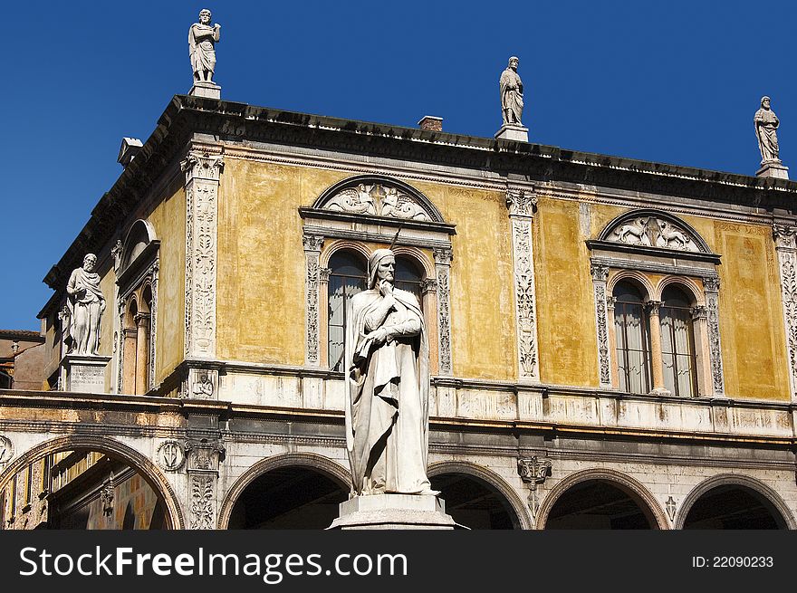 Photo of Dante square in Verone, in the foreground with the white statue of Dante Alighieri. Photo of Dante square in Verone, in the foreground with the white statue of Dante Alighieri