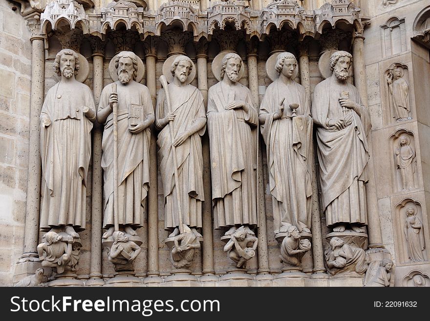 Notre Dame cathedral in Paris Europe showing entrance statues. Notre Dame cathedral in Paris Europe showing entrance statues.