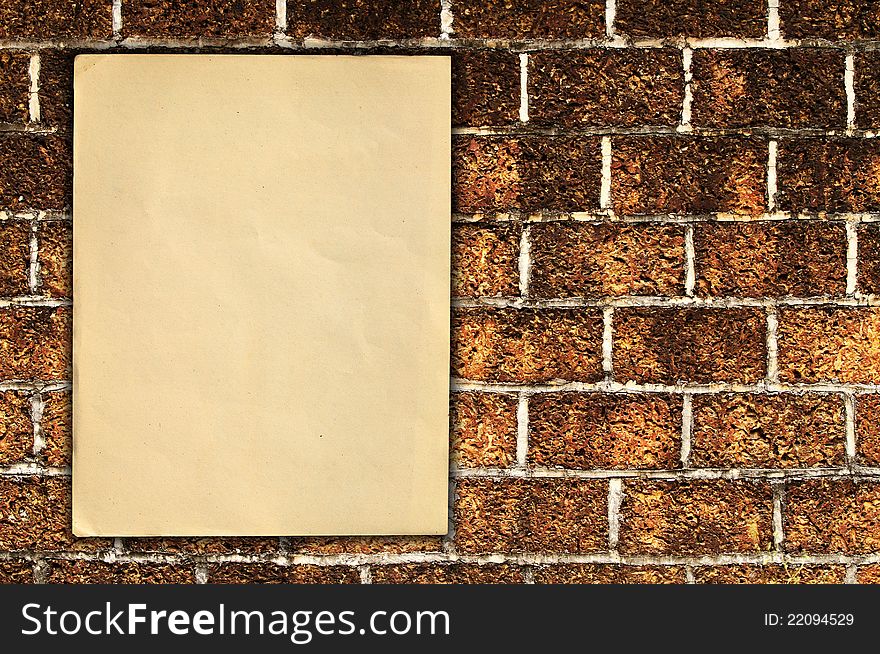 Old paper on brick wall