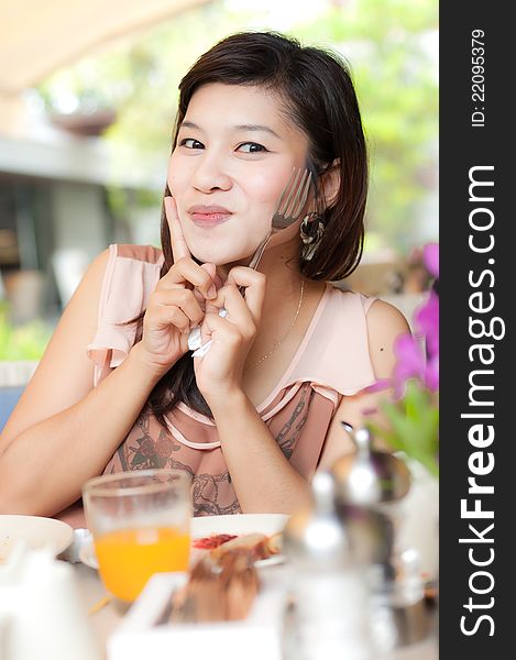 Beautiful Girl Holding Fork And Enjoy Her Food