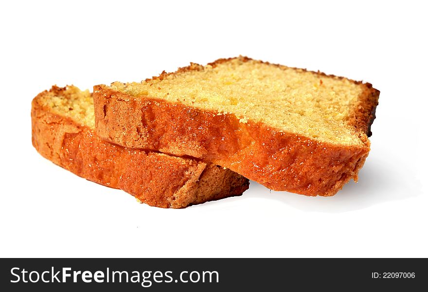 Two pieces of a home baked orange cake. Two pieces of a home baked orange cake