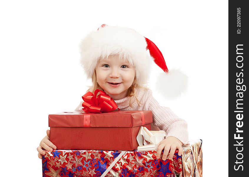 Happy child in Christmas Santa's hats with gifts