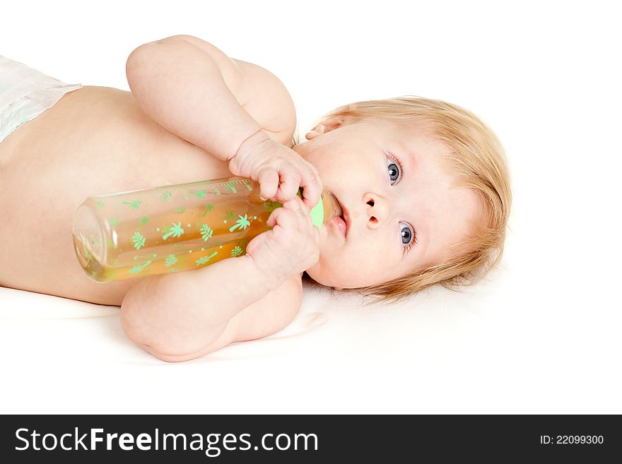 Adorable child drinking from bottle