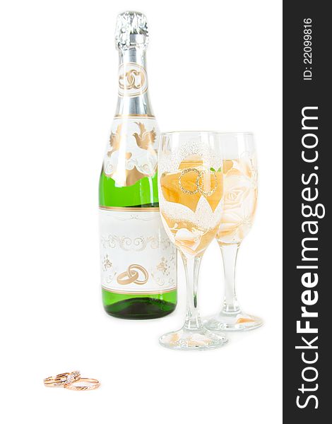 Wedding glass, bottle of champagne and rings isolated on white. Wedding glass, bottle of champagne and rings isolated on white