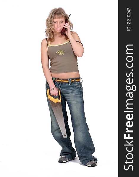 A serious  woman standing with a phone and a saw. white background. A serious  woman standing with a phone and a saw. white background