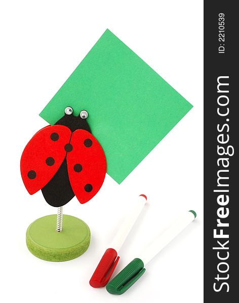 Ladybird memo-holder with two pens on white. Ladybird memo-holder with two pens on white