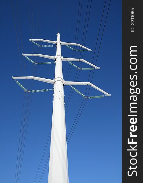 White high voltage electricity tower and power lines. White high voltage electricity tower and power lines.