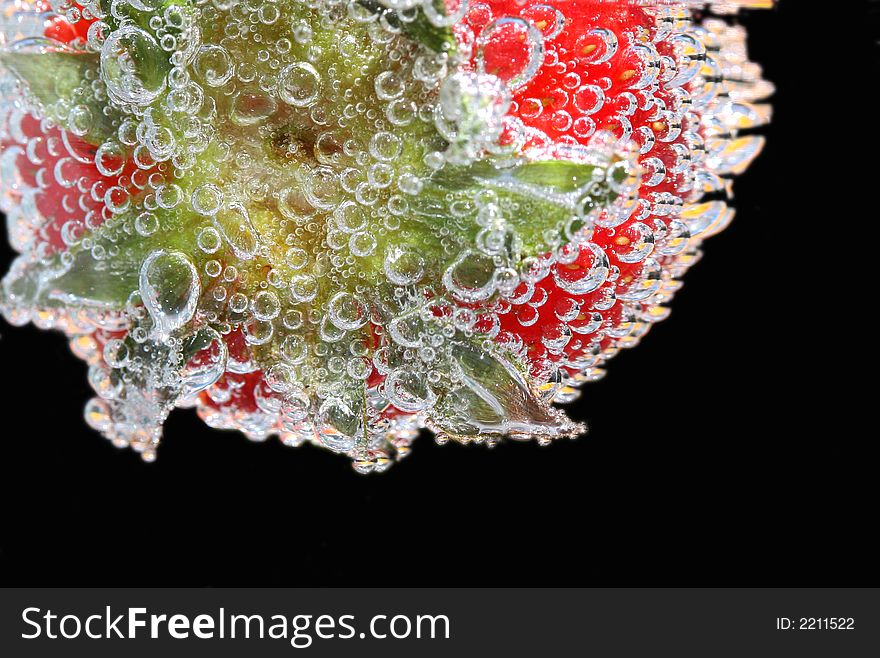 Strawberry with bubbles with black background