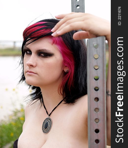 Jet black and pink hair make this rocker chic stand out. Jet black and pink hair make this rocker chic stand out