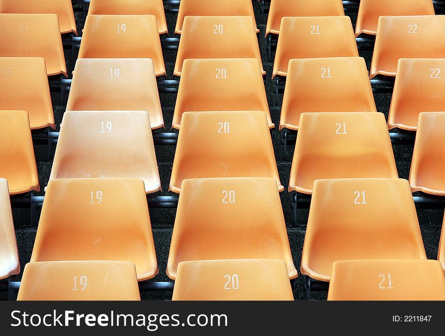 Many Empty Seats In Rows In An Outdoor Stadium. Many Empty Seats In Rows In An Outdoor Stadium