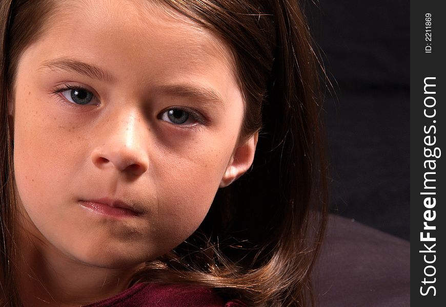 Head shot of an adorable brunette girl. Head shot of an adorable brunette girl