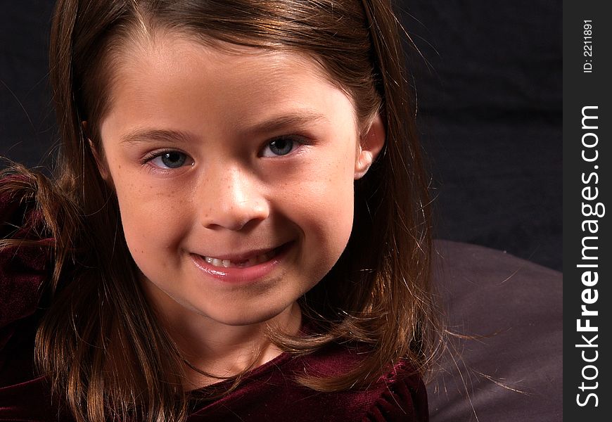 Head shot of an adorable brunette girl. Head shot of an adorable brunette girl