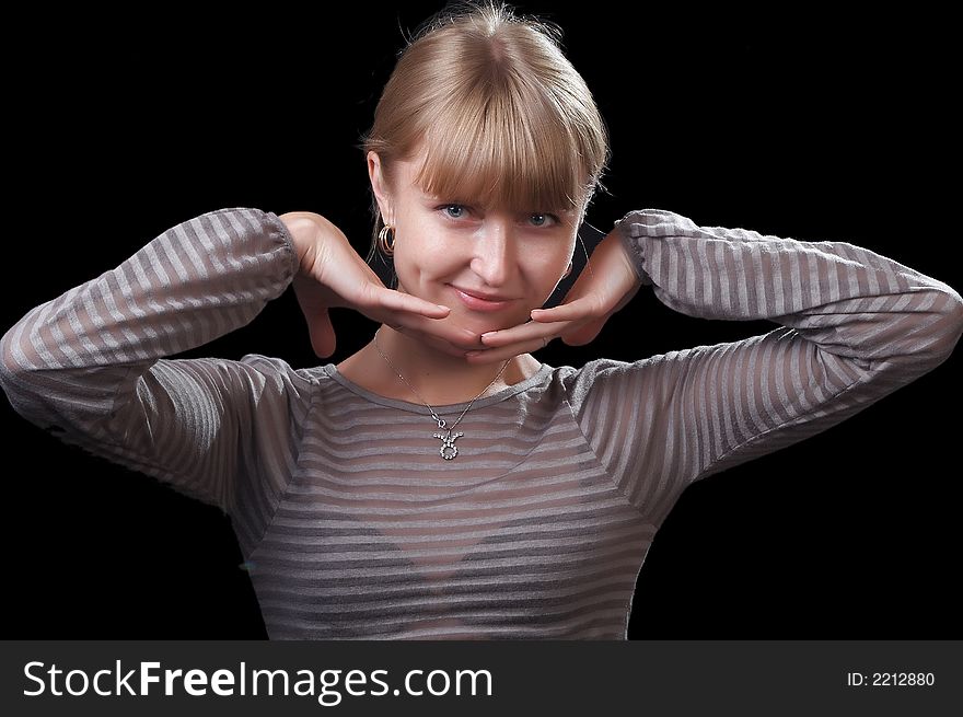 Portrait of the beautiful woman on a black background. Portrait of the beautiful woman on a black background