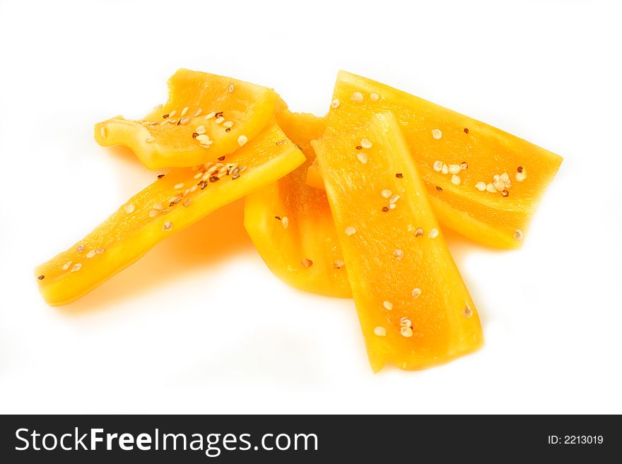 Slices of yellow bell pepper isolated on white