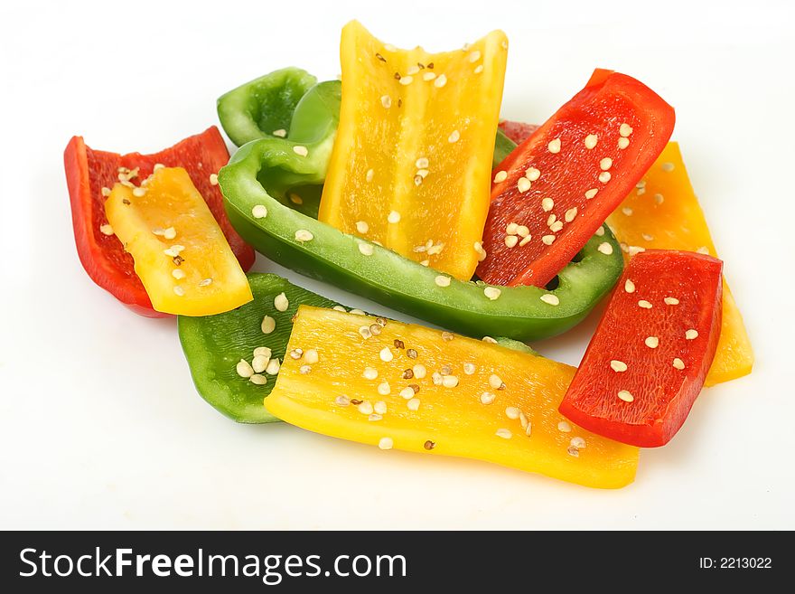 Slices of yellow, red and green bell peppers. Slices of yellow, red and green bell peppers