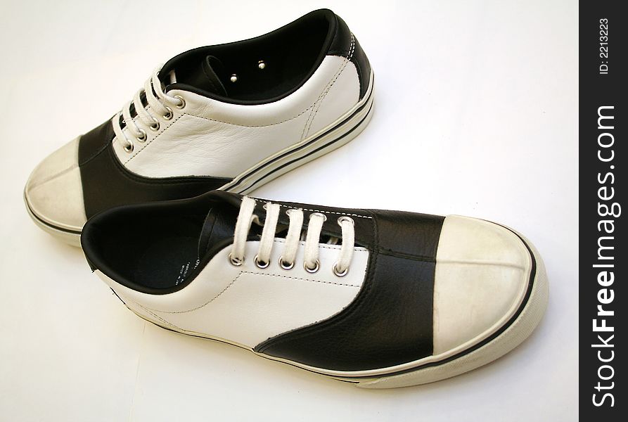 Pair of black & white sport shoes