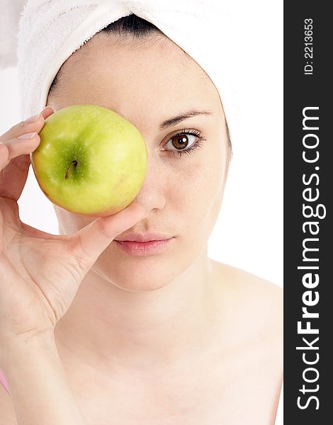 Stock photo of a young woman with green apple