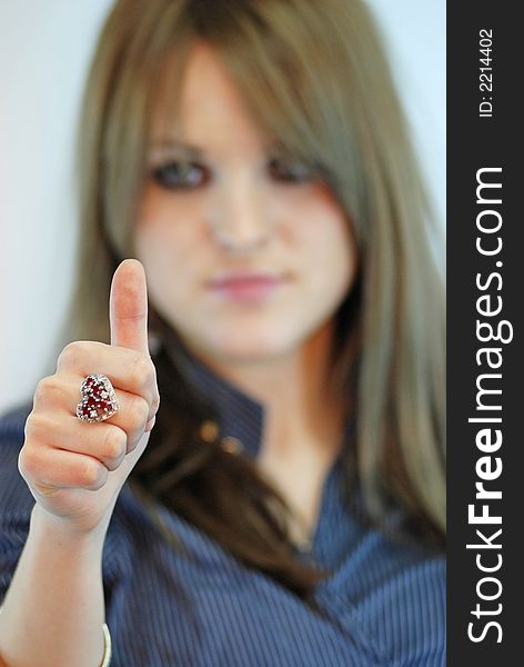 Female with finger up sign. Female with finger up sign