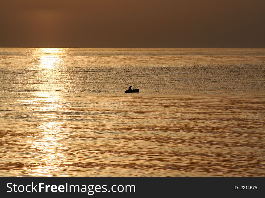 Small boat in the first sun rays