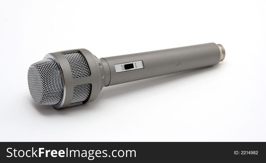 An old / retro microphone over a white background.