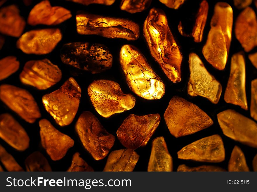 Amber; background; baltic; decoration; glass, gold; jewellery, lamp; ornament, poland; sea; stained; stone;. Amber; background; baltic; decoration; glass, gold; jewellery, lamp; ornament, poland; sea; stained; stone;