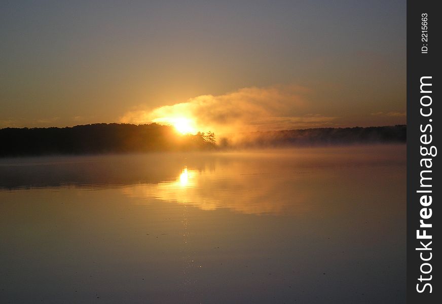 Sunrise over stony lake in shelby, MI. 

. Sunrise over stony lake in shelby, MI.