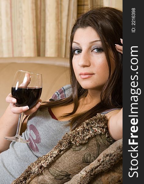 Women drinkin a glass of red wine. Women drinkin a glass of red wine.