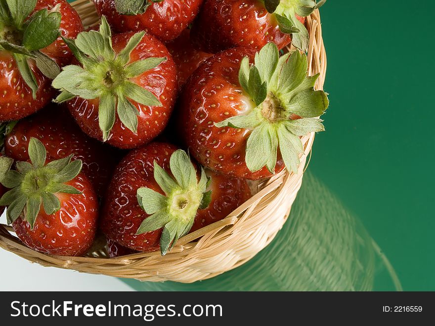 Fresh red strawberries on green background