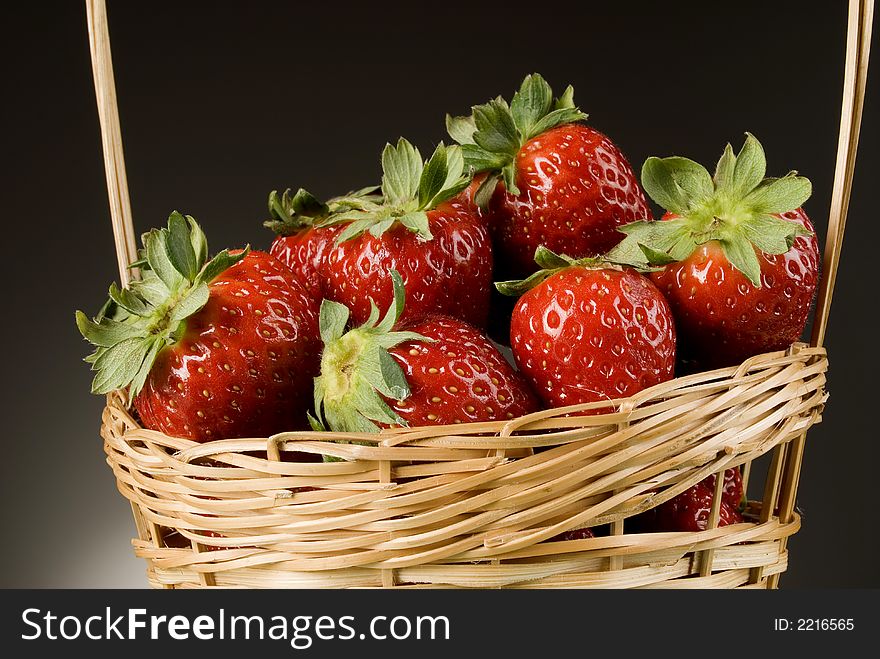 Fresh red strawberries on green background