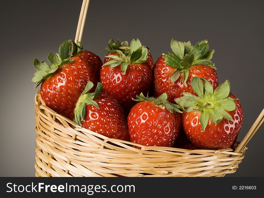 Fresh red strawberries on dark background