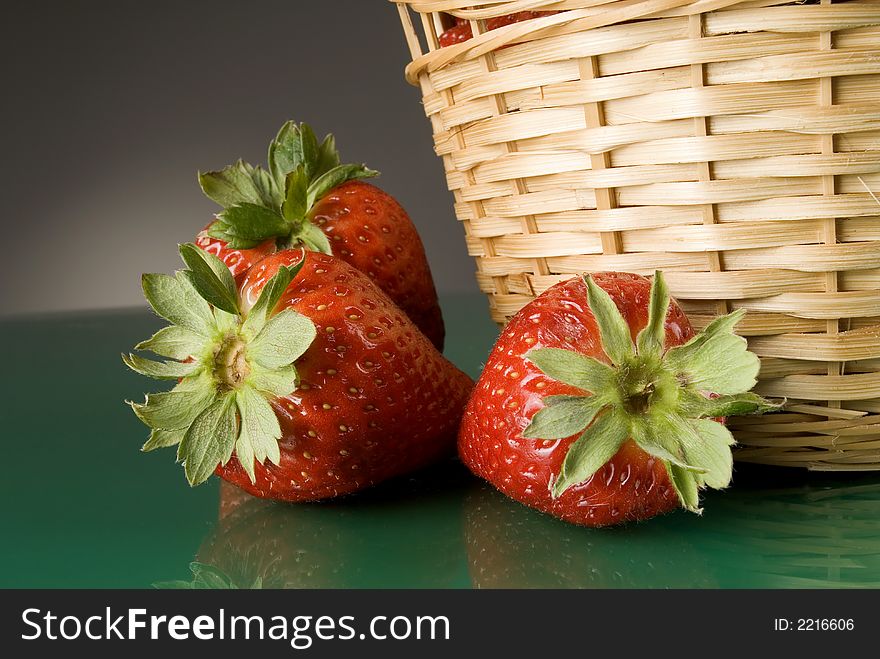 Fresh red strawberries on dark background