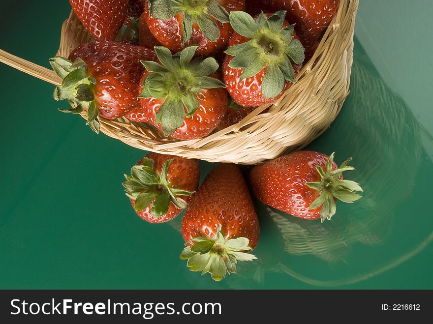 Fresh red strawberries on green background