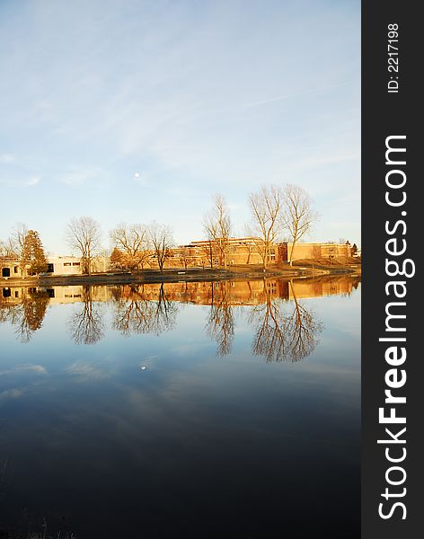 Riverside reflection of canoe club on a spring day. Riverside reflection of canoe club on a spring day