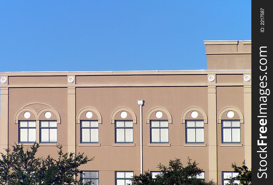 Classic architecture of office building against blue sky