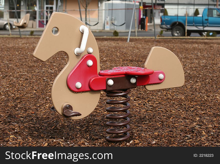 Playground horse on a metal spring. Playground horse on a metal spring