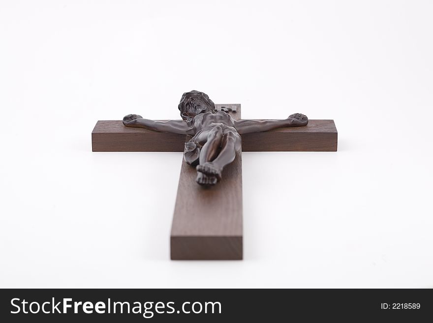 Crucifix shot from bellow with shallow DOF. isolated against white.