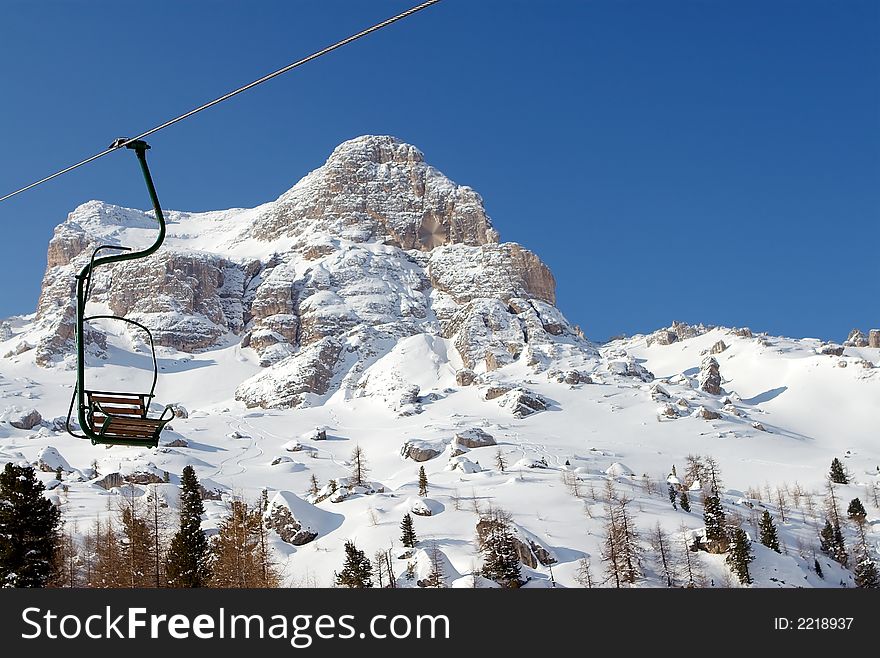 One-person chairlift in Dolomites. One-person chairlift in Dolomites