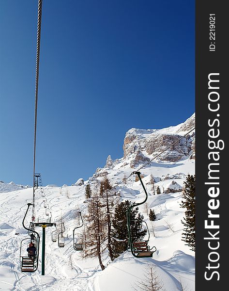 Single-seat chairlift in Dolomites. Single-seat chairlift in Dolomites