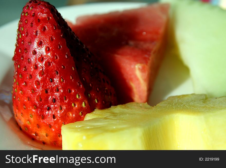 Fresh strawberries and pineapple on a platter. Fresh strawberries and pineapple on a platter