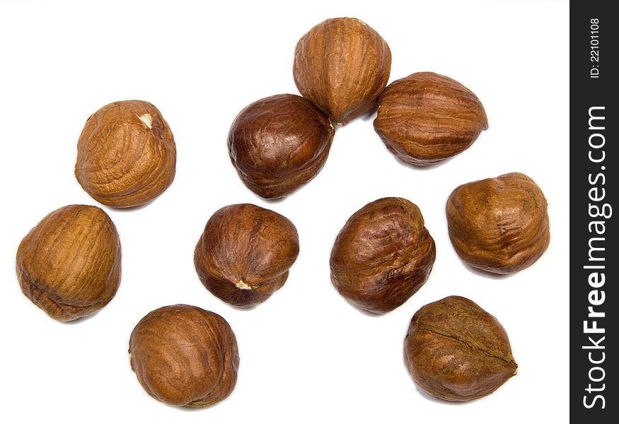Close up open hazelnuts isolated on white background.